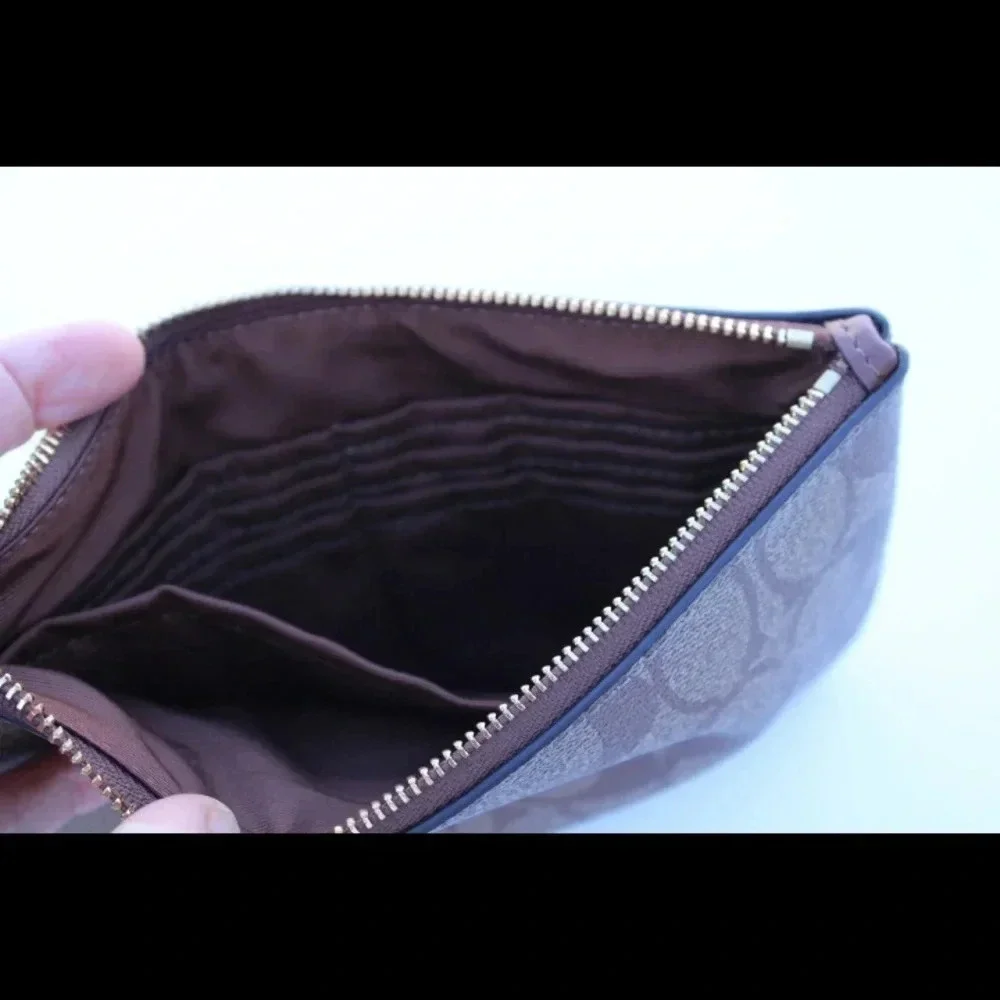 Coach signature logo cluth